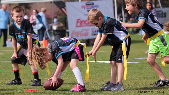 kid playing football